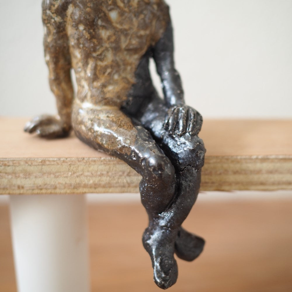Lille siddende figur